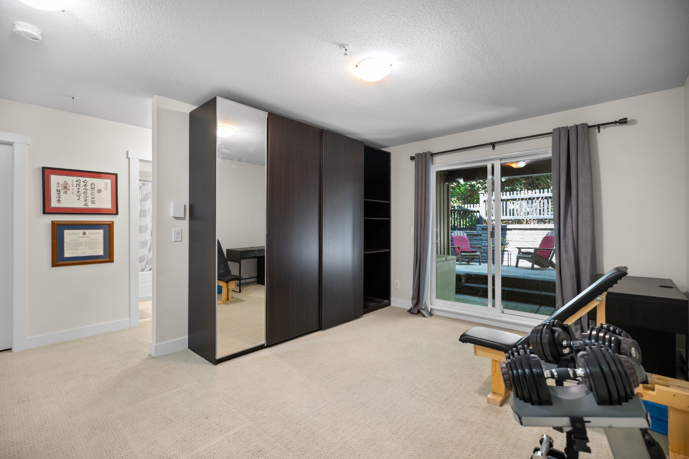         Basement recreation room with walkout basement sliding doors

